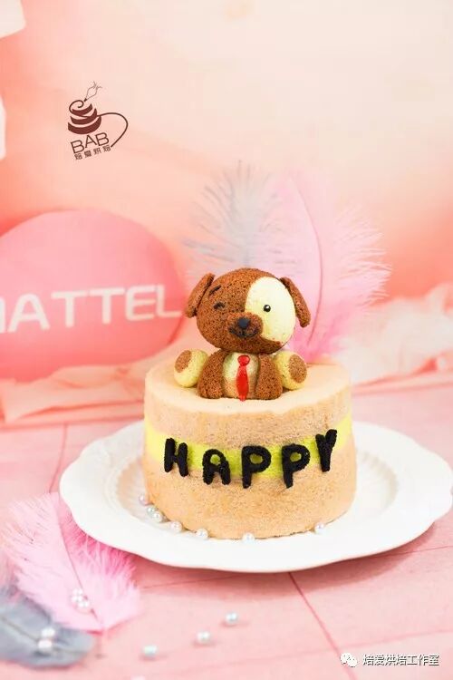 Dog character cake with HAPPY lettering on a peach textured finish